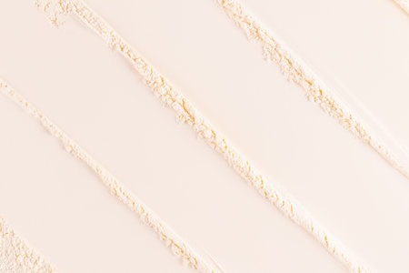 Abstract background of loose light powder. light tone mineral powder texture. matte effect. Easy to...
