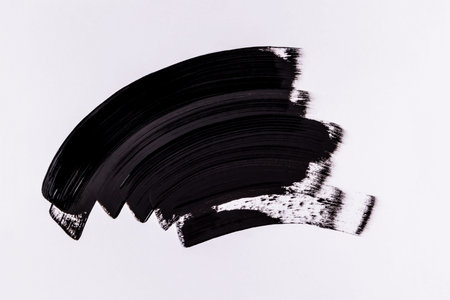 large, bold strokes of black paint. Abstract brush drawing, acrylic paint brushstroke. black texture...