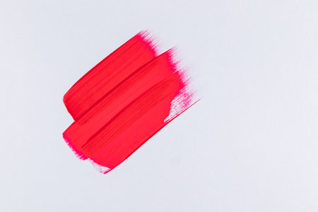 Three parallel strokes with red acrylic paint on a white background. abstract artistic background in minimalism of artistic style.の写真素材