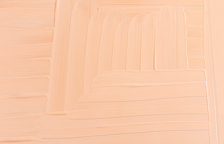 Chic cosmetic background of liquid foundation powder in a natural tone. Abstract drawing of the foundation texture. A copy of the spaceの写真素材