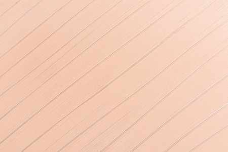 Beautiful abstract background with parallel oblique lines of liquid foundation. A sample texture of a beige tone tonal texture. cosmetic layoutの写真素材