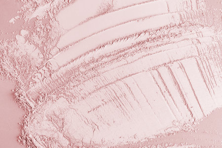 Beautiful cosmetic background of loose texture of dry powder, blush with brush strokes. top view. Abstract background of an organic product sampleの写真素材