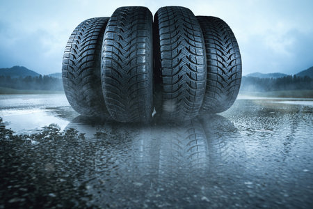 Car tires on a wet roadの写真素材