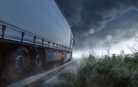 Truck is driving in the rain