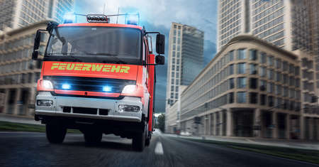 Fire brigade use fire engine with flashing blue lightの写真素材