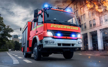 Fire brigade use fire engine with flashing blue lightの写真素材