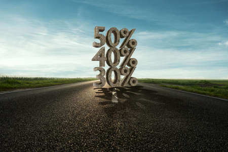 50 percent discount on asphalt road and blue sky background. 3d renderingの写真素材