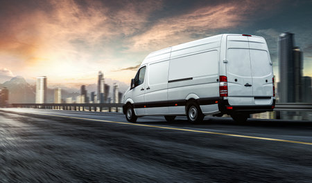 White commercial delivery van on the road with cityscape background. 3d renderingの写真素材