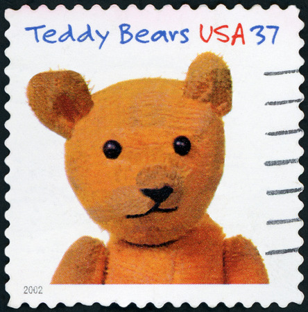 UNITED STATES OF AMERICA - CIRCA 2002: A stamp printed in the United States of America shows image of teddy bear, circa 2002のeditorial素材