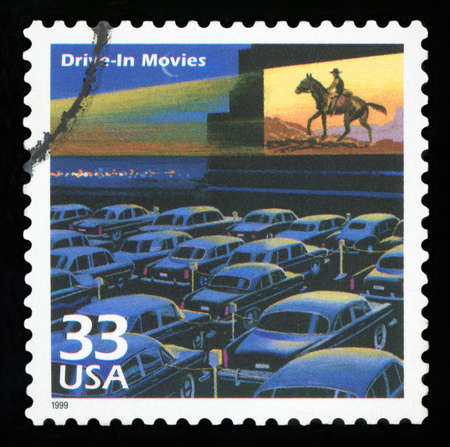 UNITED STATES -CIRCA 1999: A postage stamp printed in USA showing an image of a fifties drive-in movie theater, circa 1999.のeditorial素材