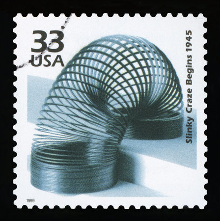 UNITED STATES OF AMERICA - CIRCA 1999: a postage stamp printed in USA showing an image of the slinky...