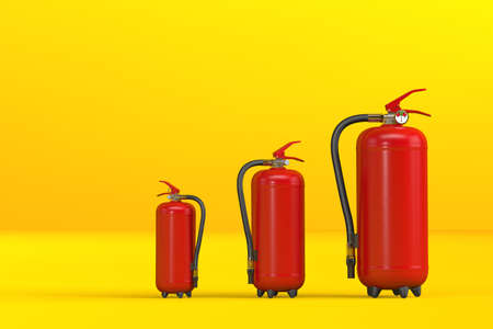 A set of three fire extinguishers positioned on a yellow gradient background with space for text - banner - 3d renderの写真素材