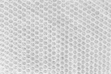 Texture of plastic bubble - close-up of a fragment of plastic bubble for securing shipments
