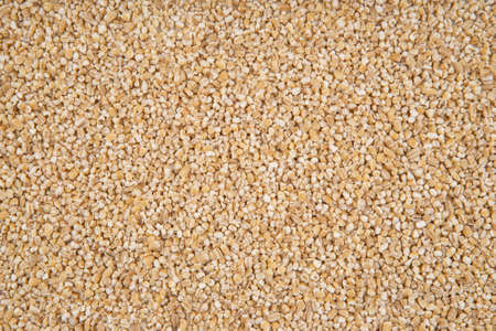 The texture of barley groats - top view and close-up on the grains of barley groatsの写真素材