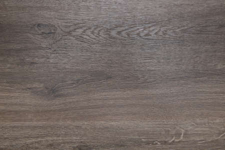 Wood texture - top view and close-up of dark brown laminate veneerの写真素材