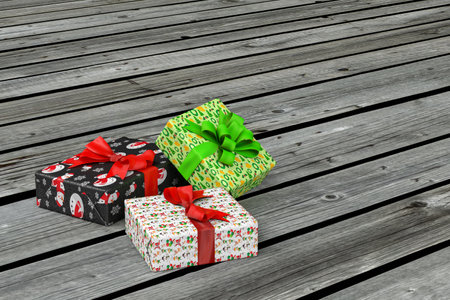 Christmas gifts - three cardboard boxes wrapped in paper with Christmas theme on wooden black and white floor or platform - copy space - 3D renderの写真素材