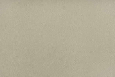 The texture of beige linen fabric - top view and close-up of a piece of fabricの写真素材