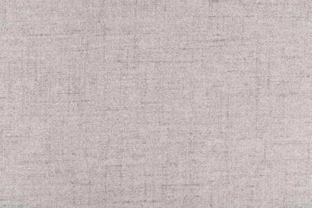 The texture of light beige linen fabric - top view and close-up of a piece of fabricの写真素材