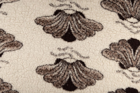 White woolen fabric texture - top view and closeup on a piece of woolen blanket with butterfly...