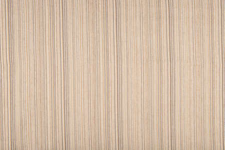 Light beige fabric texture - top view and close-up on a piece of beige striped linen fabricの写真素材