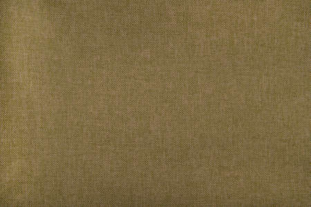 Light beige fabric texture - top view and close-up on a piece of linen fabricの写真素材