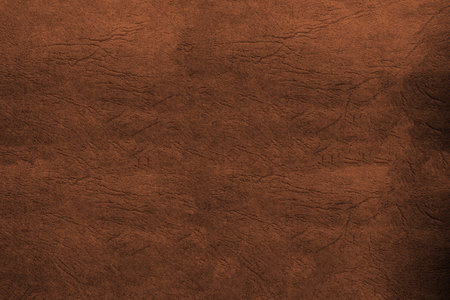 Texture of leather fabric - top view and close-up on a piece of brown leatherの写真素材