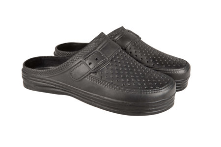 Garden shoes - low black shoes for gardening work on a white backgroundの写真素材