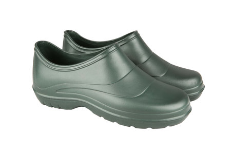 Garden shoes - low green women's shoes for gardening work on a white backgroundの写真素材