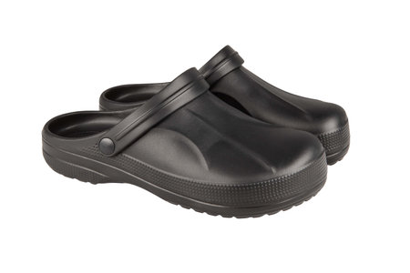 Garden shoes - low black shoes for gardening work on a white backgroundの写真素材