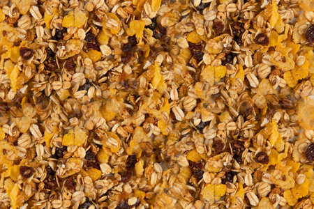 Granola texture - top view and close-up of muesli flakes with raisins, nuts and dried fruits
