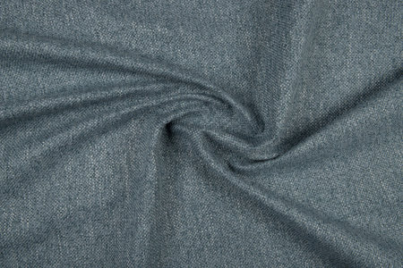 Gray blue fabric texture - top view and close-up of a piece of crushed and twisted blue linenの写真素材