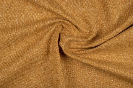Yellow-orange fabric texture - top view and close-up of a piece of crushed and twisted red linenの写真素材