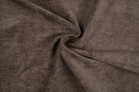 Brown fabric texture - top view and close-up of a piece of crushed and twisted brown linenの写真素材