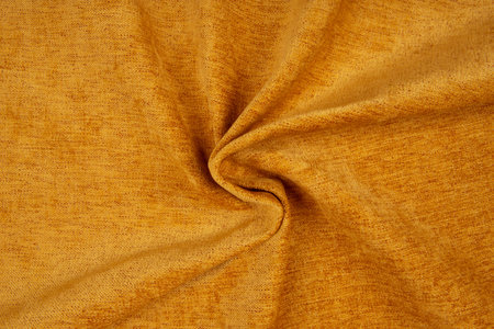Yellow fabric texture - top view and close-up of a piece of crushed and twisted red linenの写真素材