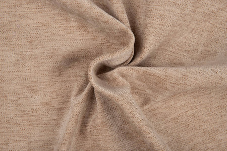 Dark beige fabric texture - top view and close-up of a piece of crushed and twisted brown linenの写真素材