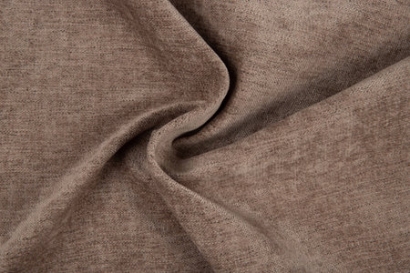 Brown fabric texture - top view and close-up of a piece of crushed and twisted brown linenの写真素材