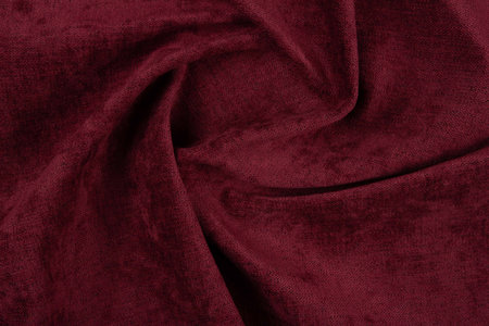 Maroon fabric texture - top view and close-up of a piece of crushed and twisted red linenの写真素材