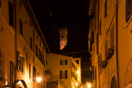 Antique and medieval clock tower in Romagna village, urban view for tourism - travel in Italyのeditorial素材