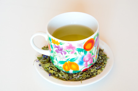 Mallow herbal tea cup on orange backgroundの写真素材