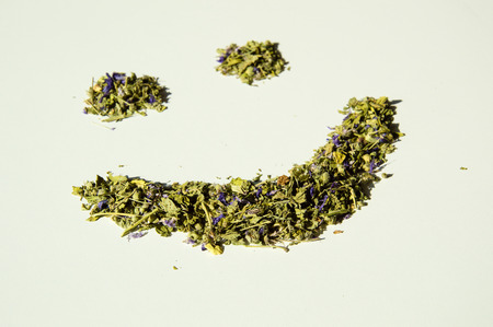 Happy smile of mallow herbal tea isolated closeup on white backgroundの写真素材