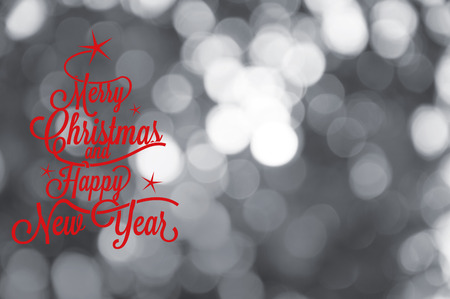 Merry Christmas and happy new year greetings postcard with blur light bokeh silverの写真素材