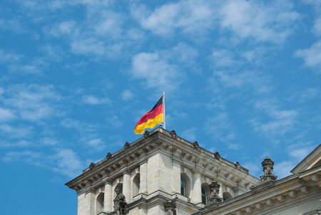 Close-up of German flag on famous Reichstag building, seat of the German Parliament (Deutscher Bundestag), travel in Berlinのeditorial素材