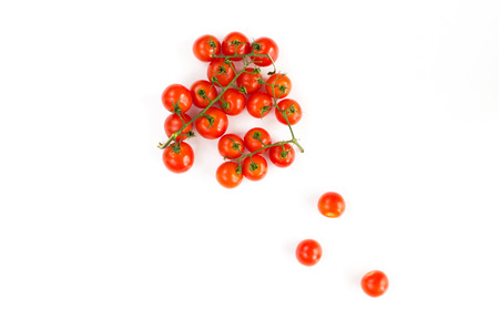 Italian raw red tomatoes cherry closeup isolated on white backgroundの写真素材