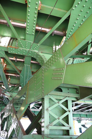 Part of the steel structure bridge, Metal structures under the bridge, large metal bridge over waterの写真素材