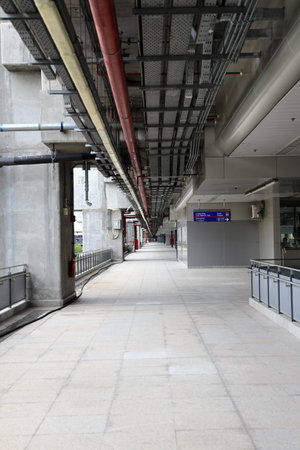 Pedestrian pathway or corridor or hallway between train station and airport building.
