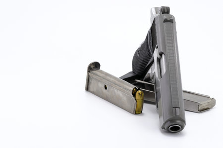 The compact Semi automatic pistol, stainless steel PPKs pistol with spare magazines right side view,...