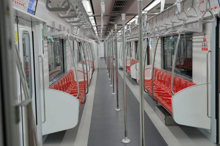 An interior view of empty suburb Red Line Mass Transit System.