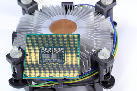 Close up Hight performance CPU with active Aluminum and copper  heatsink isolated on white...