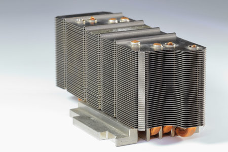 A close up view of passive CPU cooler with the aluminum fin and copper heat pipe structure isolate...