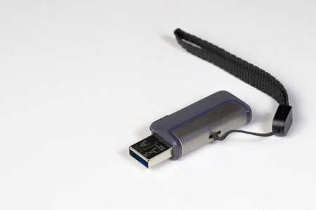 The dual USB-C or USB Type-C Flash Drive with strap for smartphones or computer on white background....